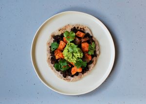Mexican-inspired flatbreads with black beans, sweet potato and green pea ‘guacamole’ 